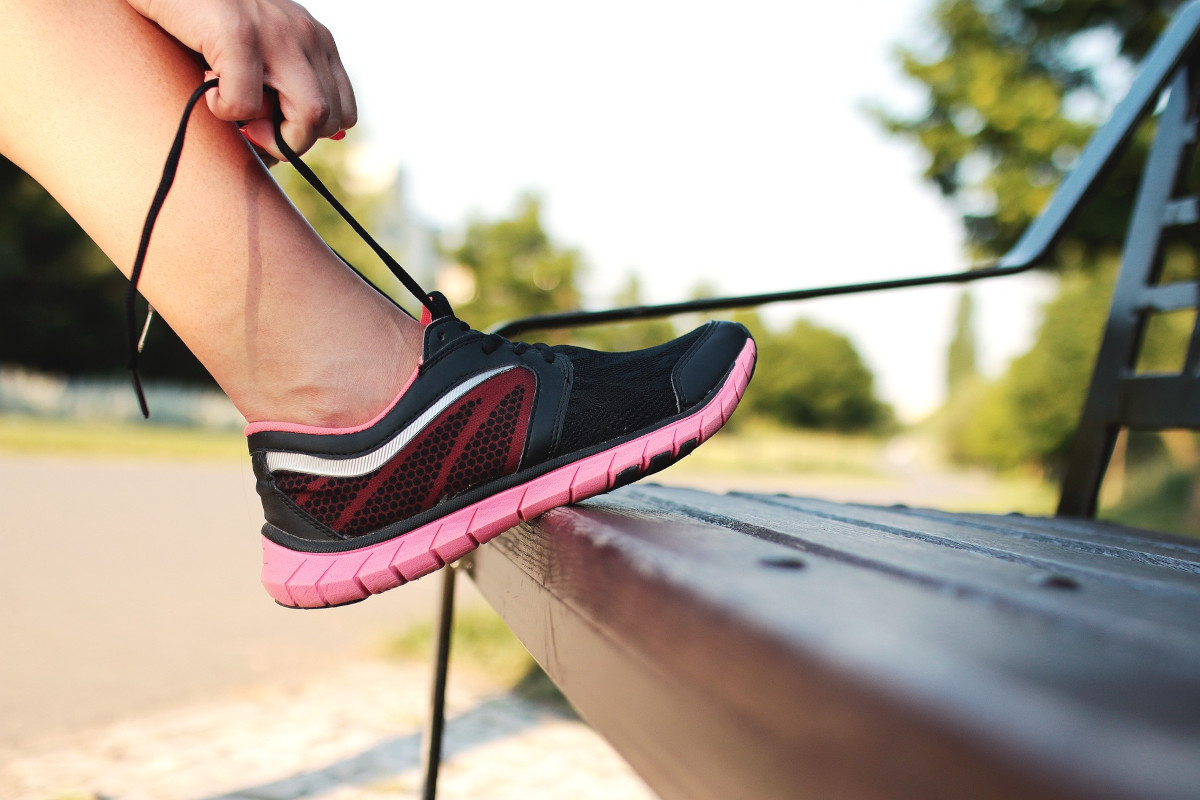 Running shoe resting on a bench